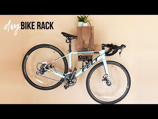 I'm showing you how I created this #diy wall-mounted bike rack with storage for your #bicycle, water bottles, helmet, and keys