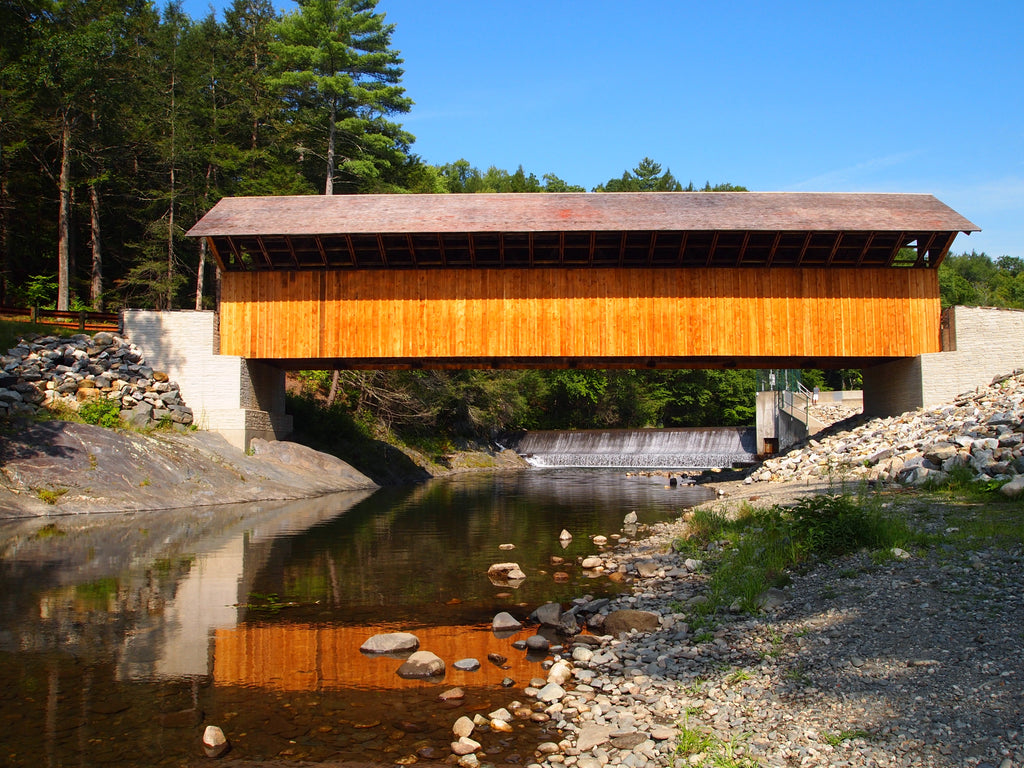 Tucked away in the rolling hills of Greenfield, Massachusetts, is a rather large covered bridge with a long history to match